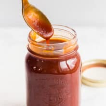 homemade barbecue sauce drizzled from spoon