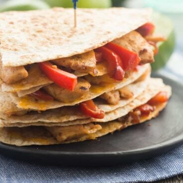 Honey Lime Chicken Quesadillas are filled with chicken, peppers, onions and cheese and are the perfect easy weeknight or summer meal! My whole family LOVES these!