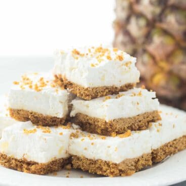 My version of my Mom's Pineapple Squares -- almost no bake dessert that's perfect for Spring or Easter! Light and fluffy and full of crushed pineapple!